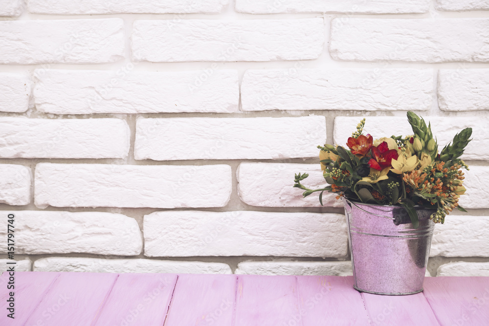 bouquet of flowers in a bucket