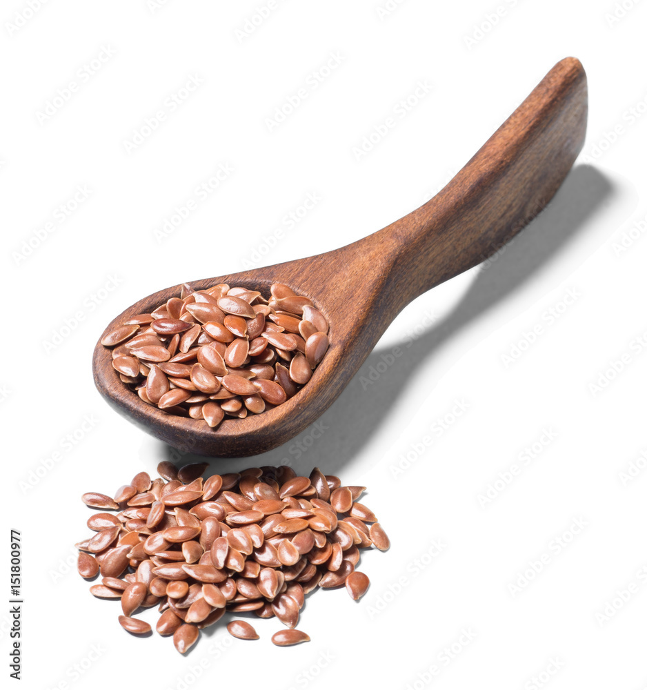 uncooked flax seeds on white, (large depth of field, taken with tilt shift lens) uncooked flax seeds on white, (large depth of field, taken with tilt shift lens)