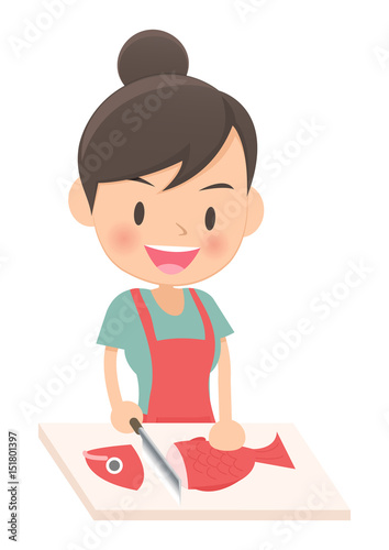 料理をする主婦　魚を切る