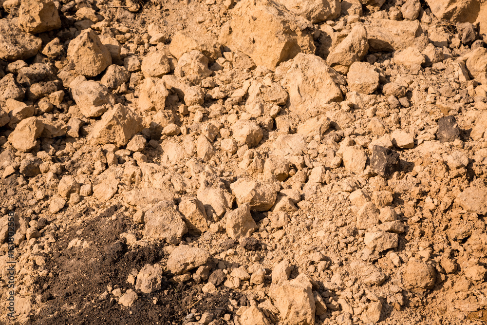 Clay and sand in the quarry. Beautiful unusual background similar to the surface of the planet Mars or the moon Clay and sand in the quarry. Beautiful unusual background similar to the surface of the planet Mars or the moon