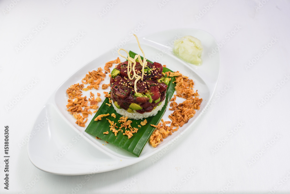 Delicious japanese dish of rice, tuna and avocado Delicious japanese dish of rice, tuna and avocado