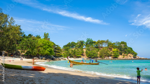 Tourists on Paradise Beach - one of the beaches of Phuket island, Thailand. Picture aspect ratio 16: 9 