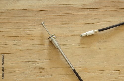 Obraz na plátně classic camera shutter cable released on wooden board