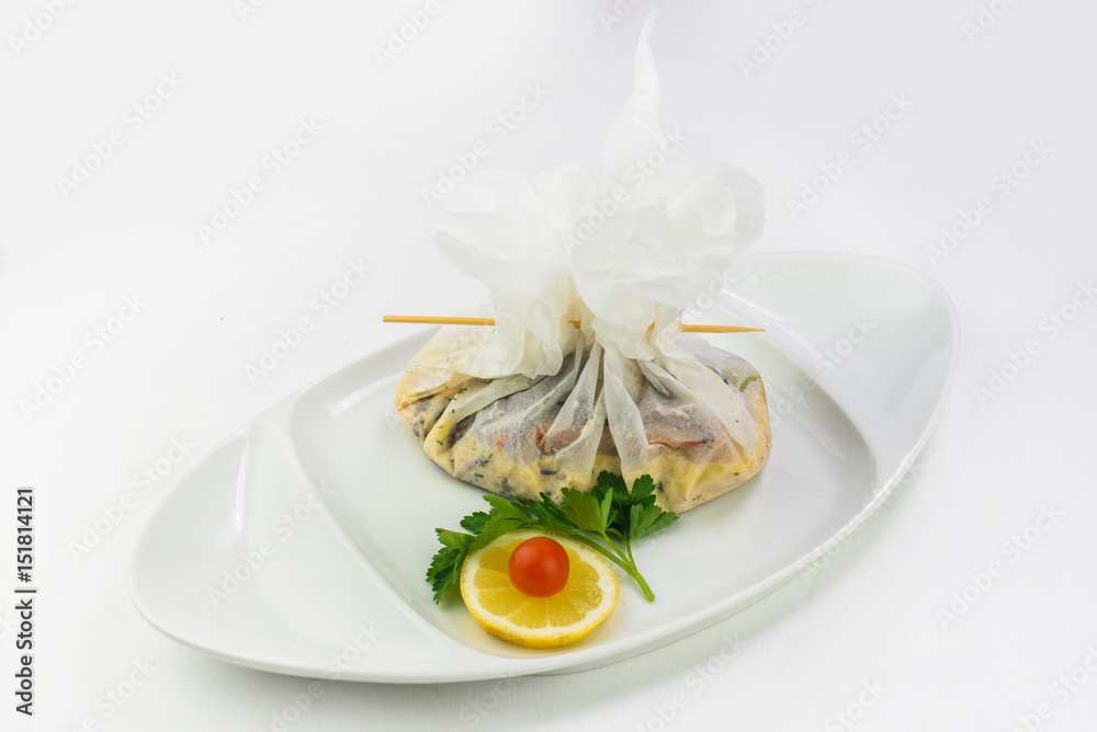 Japanese dish served in a little white bag Japanese dish served in a little white bag