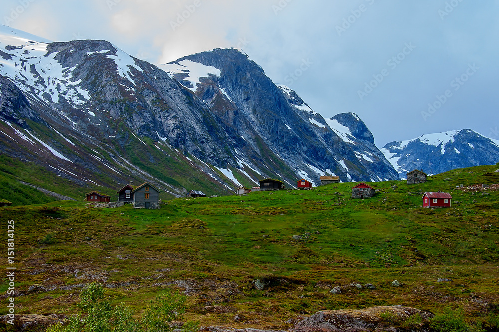 Traditional Norwegian house at the foot of the hill