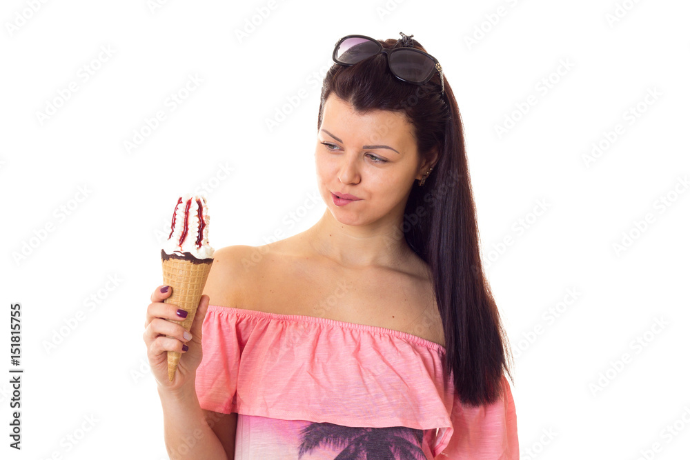 Woman in dress with sunglasses holding ice-cream
