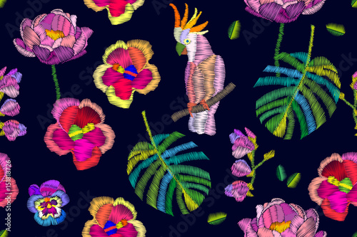 Summer night. Seamless vector pattern with parrot and exotic flowers. 