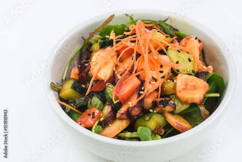 Seafood salad with cucumbers, pulp, carrots and balsamic vinegar