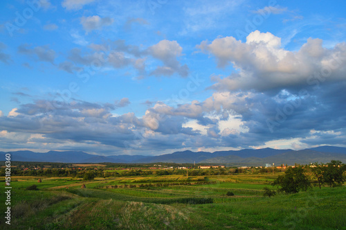 Rural sunset with colorful clouds.