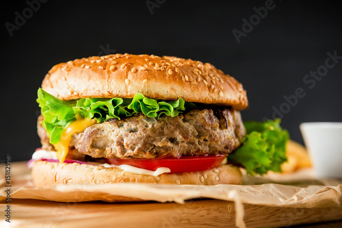 Classic american hamburger with beef. Dark background
