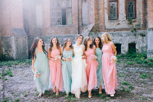 Beautiful bride with her pretty bridesmaids photo