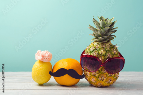 Sticker Pineapple, grapefruit and lemon over mint  background
