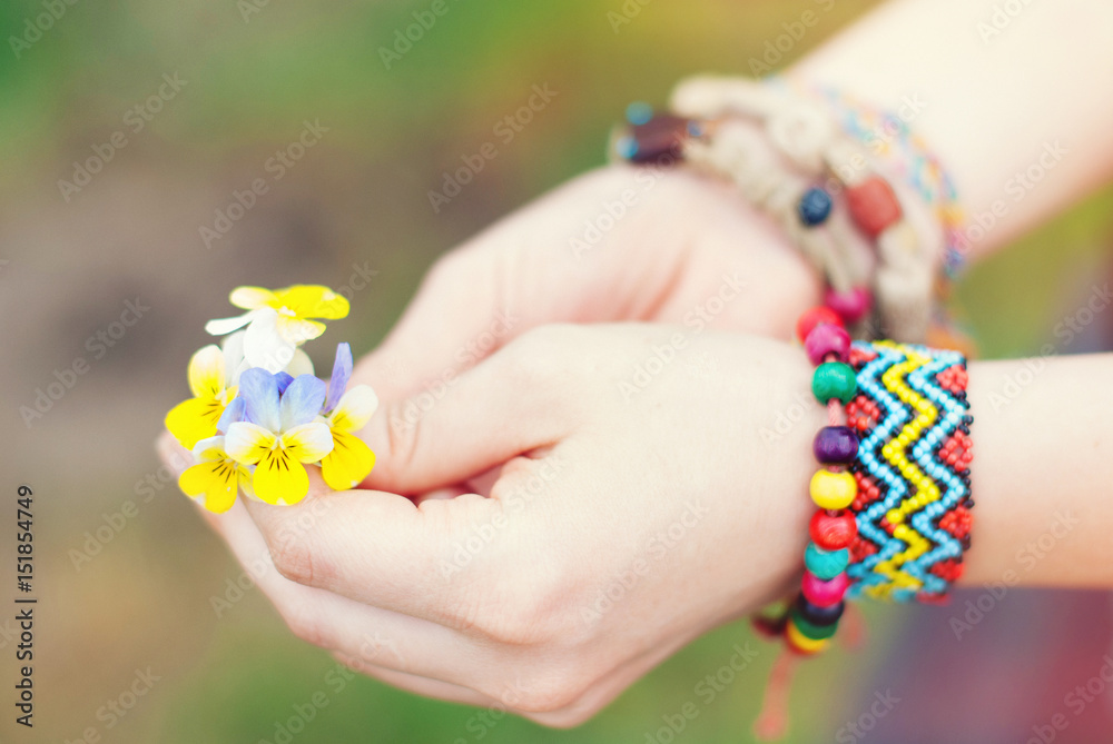 Woman's hands with flowers violets. Spring time. Summer time. Woman's hands with flowers violets. Spring time. Summer time.