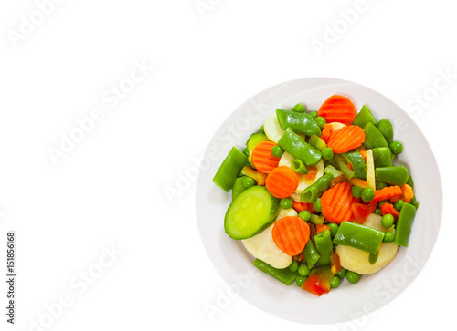 Mixed vegetables on a plate. top view. isolated on white