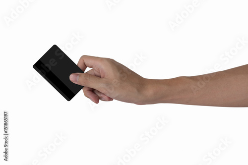 man's hand holding blank black credit card mockup with black magnetic stripe isolated with white, back side view.