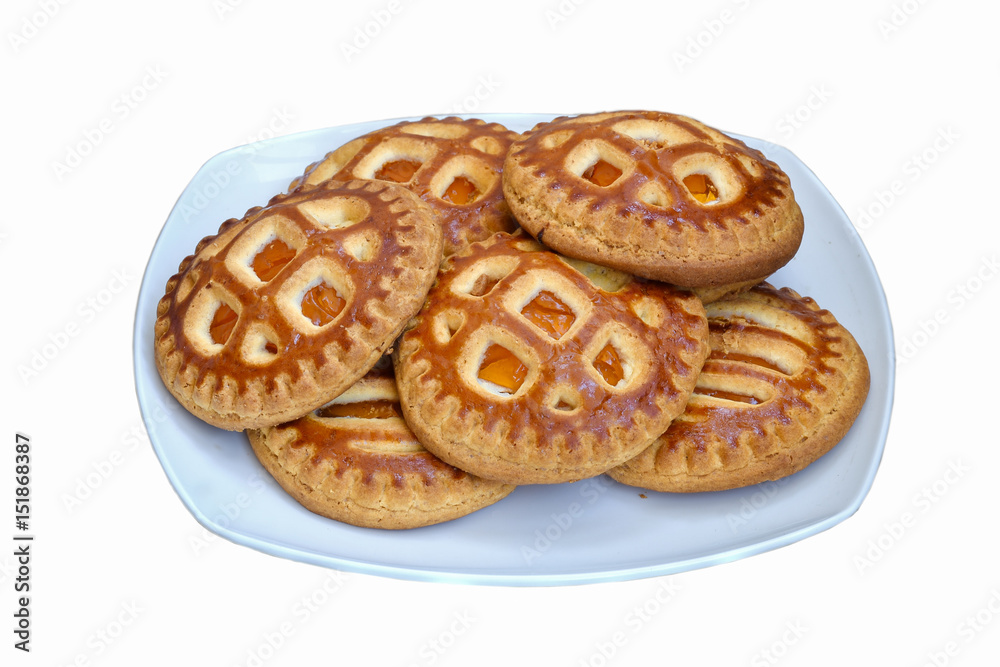Cookies with dried apricots on a plate. Isolated on white background. Cookies with dried apricots on a plate. Isolated on white background.
