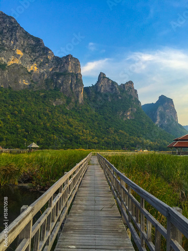 Beautiful landscape with wooden bridge, fields and mountains, Bueng Bua at Sam Roi Yot National Park, Prachuap Khiri Khan Thailand