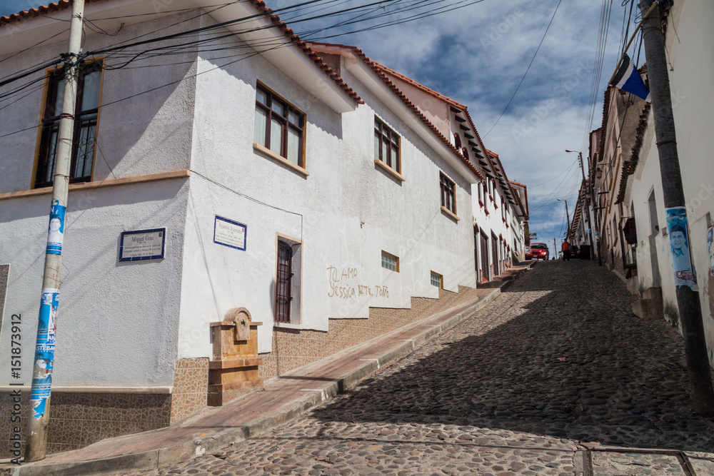 SUCRE, BOLIVIA - APRIL 21, 2015: Steep cobbled street in Sucre, Bolivia
