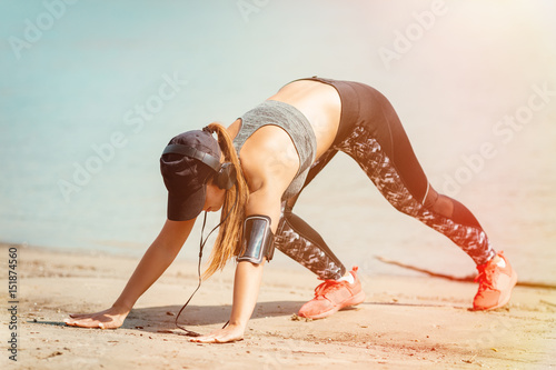 Cute Girl Exercising On The Beach