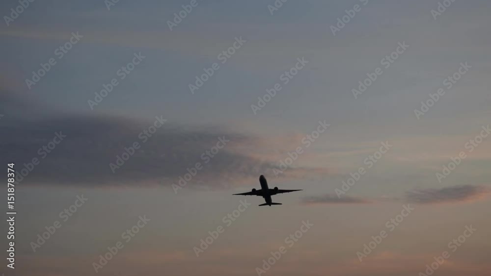 Airplane take off at sunset, light sky Airplane take off at sunset, light sky