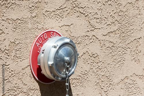 Firefighter standpipe in a stucco wall