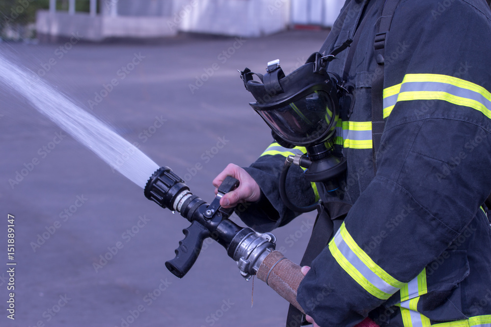 Fototapeta premium Water extingisher in hands