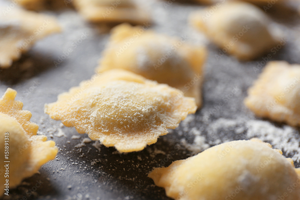 Uncooked ravioli on table, closeup Uncooked ravioli on table, closeup