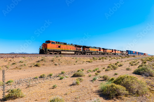 Obraz na płótnie Freight Train driving through Mojave Desert , California, USA w salonie