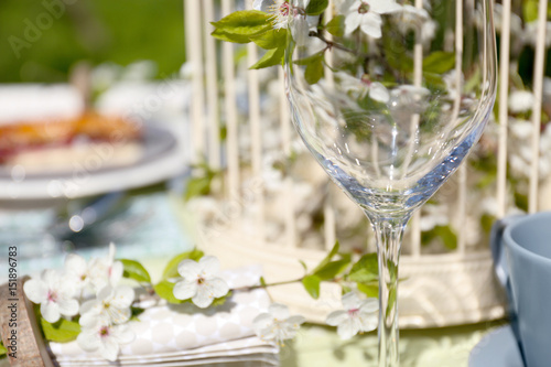 Wine glass on served festive table, closeup