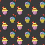 Seamless pattern with cupcakes on the black background.