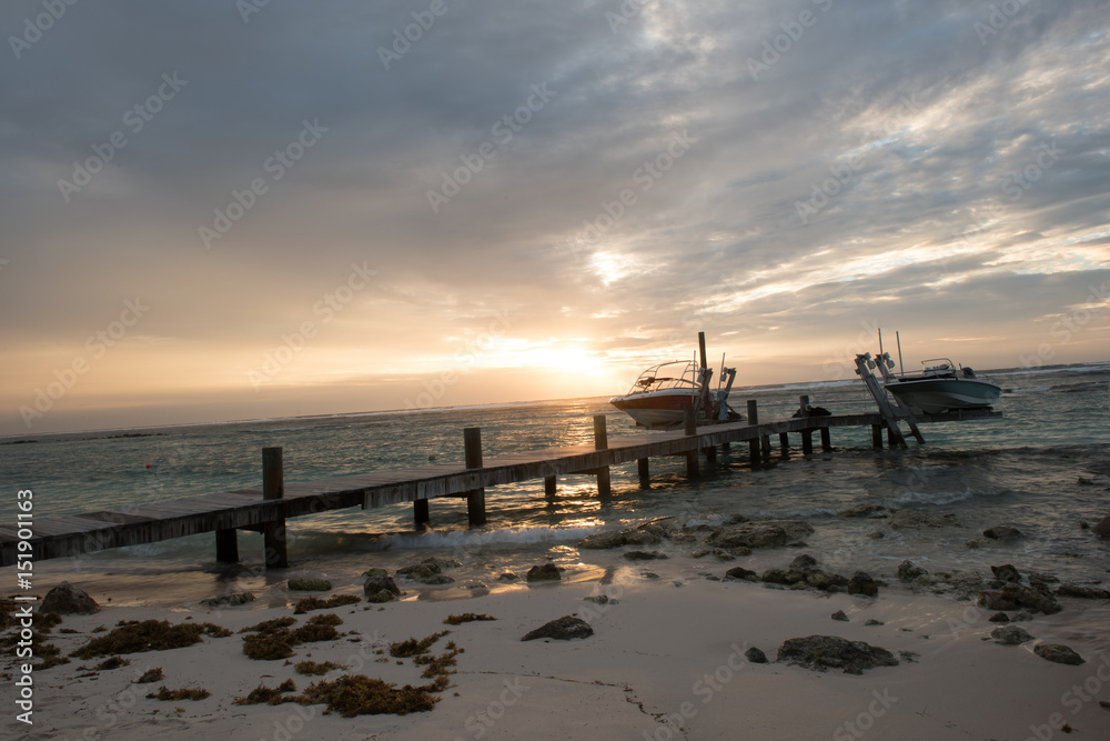 Tropical caribbean beach resort in the early morning sunrise