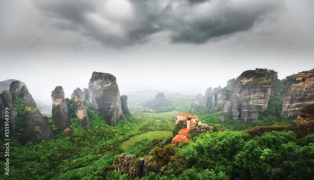 Meteora monasteries in Greece, UNESCO legacy list object. Scenery with dramatic sky after rain.