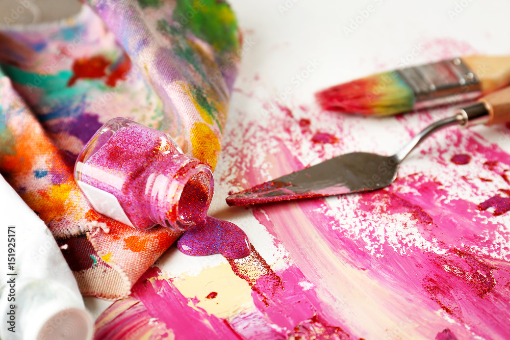 Fototapeta premium Artist supplies and accessories with paint on paper