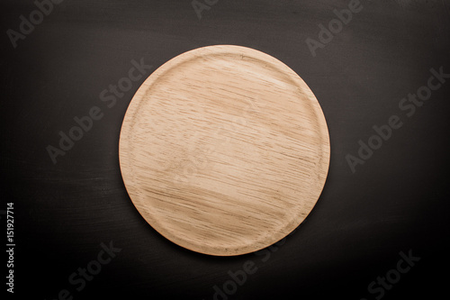 empty wooden plate  wood texture background can use to pizza on plate and copy space etc.;