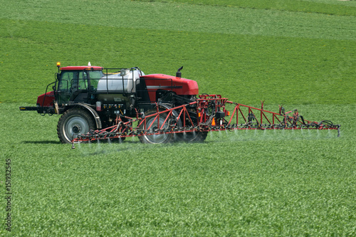 Photography Tractor with agricultural sprayer machine for pesticide spraying
