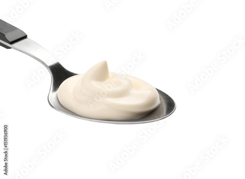 Delicious mayonnaise in spoon isolated on white