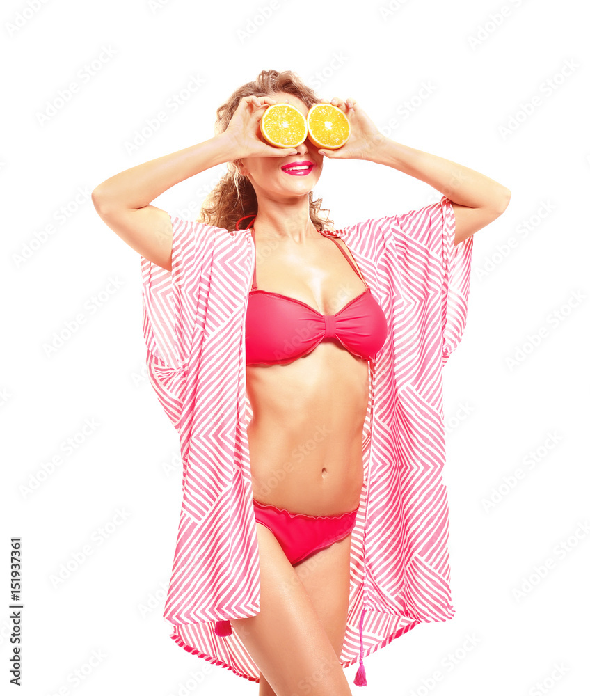 Beautiful young woman in beachwear with orange halves on white background Beautiful young woman in beachwear with orange halves on white background