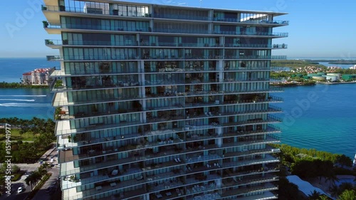 Aerial flyover Apogee to reveal Fisher Island Miami Beach drone 4k