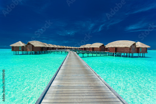 Overwater villas on the tropical lagoon  Maldives