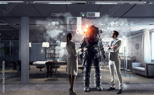Scientists designing space suit. Mixed media photo
