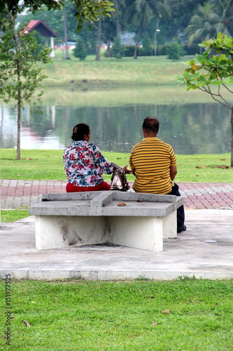 Photography The old couple in fron of lake in Kallang Riverside park in Singapore