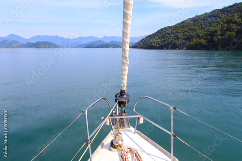 landscape view of sea and tropical islands seen from a moving sailing boat