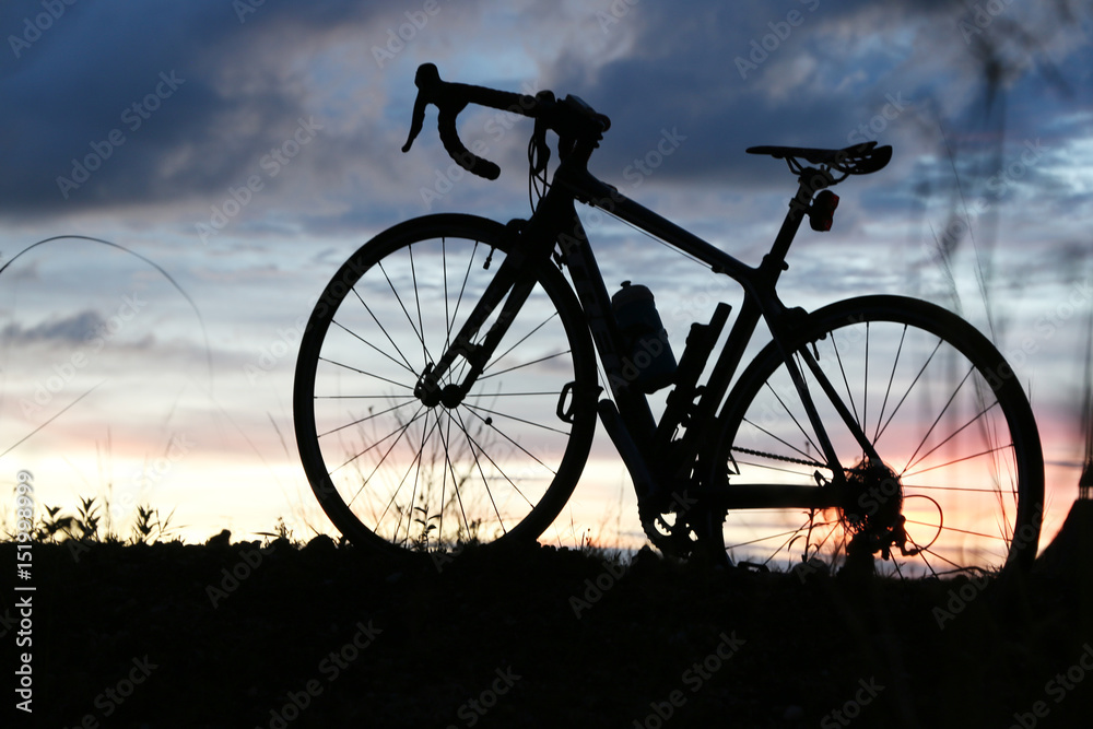 bicycle silhouette on sunset in Summer 