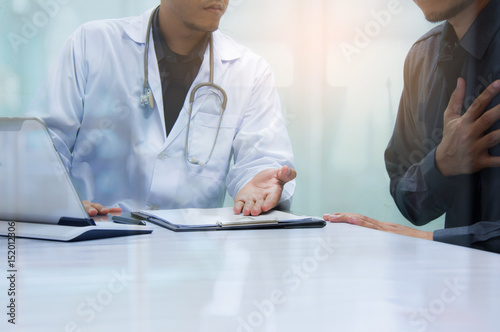 Doctor and patient are discussing in the hospital room