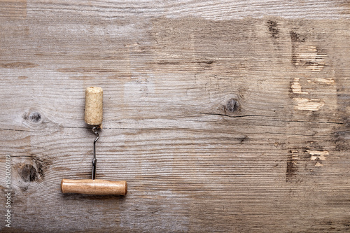 cork and corkscrew on wooden background
