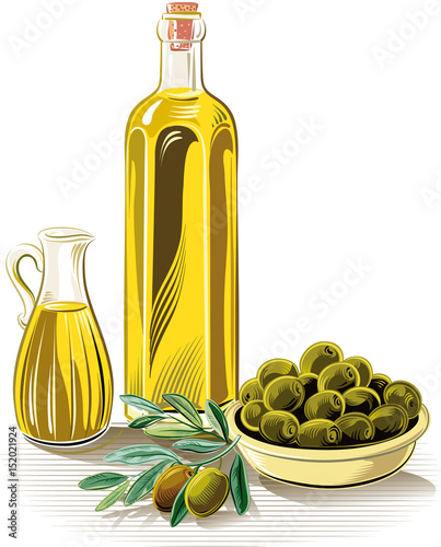 Olives in a bowl, an olive branch, a bottle of olive oil and a cruet with olive oil.