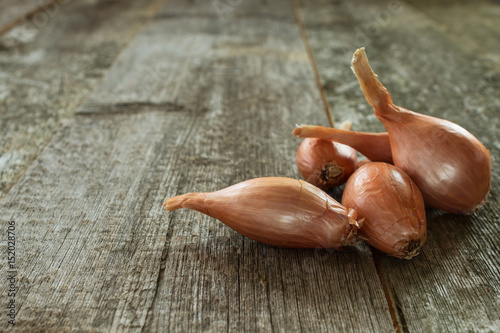 Shallot onion on a wooden background