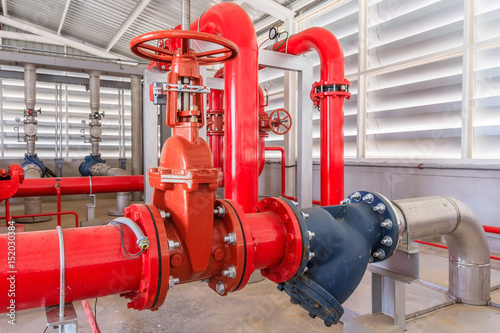 Industrial fire pump station for water sprinkler piping and fire alarm control system. Pipelines, water pump, valves, manometers.