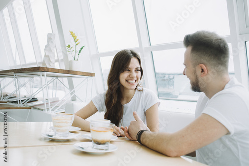 Attractive young couple on a date in a cafe