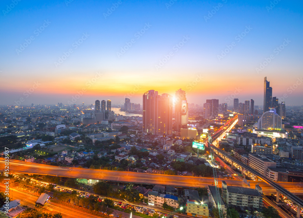 Aerial view of Bangkok modern office buildings, condominium, living place in Bangkok city downtown with sunset scenery, Bangkok , Thailand